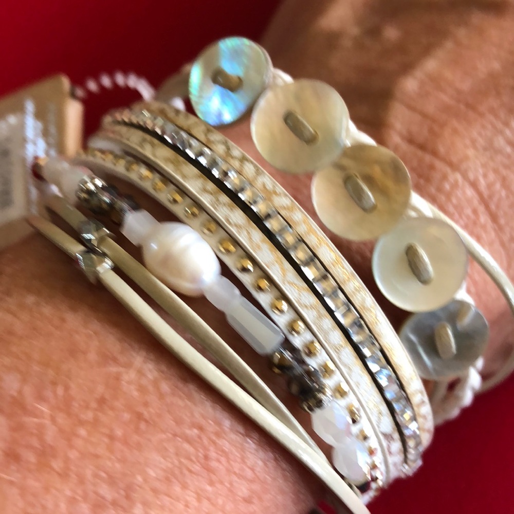 Magnetic bracelet with button and bead accents.